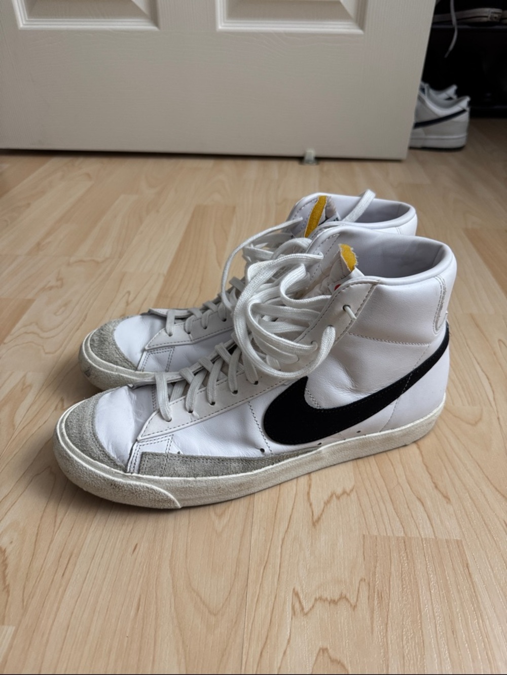 Nike White High-Top Sneakers with Black Swoosh and Gray Suede Accents